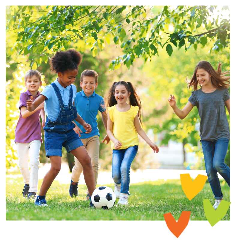 Kids playing outside with a soccer ball